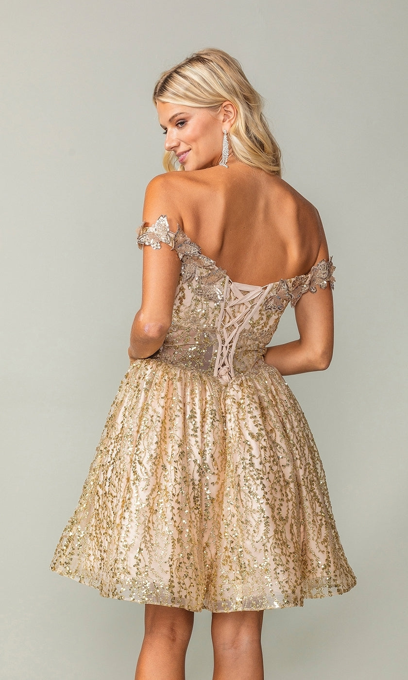 A woman in the Glitter Short Gold Butterfly Homecoming Dress 3370—an off-the-shoulder, gold lace dress with fitted bodice and corset back—stands turned away, showcasing a stunning semi-formal look for homecoming.